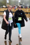 A pair laugh as they walk