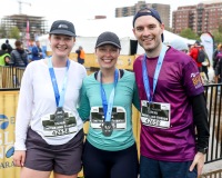 A group of runners smile at the camera