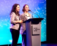 Two women at the podium