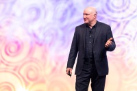 A man gestures during his presentation