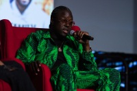 A man speaks on stage